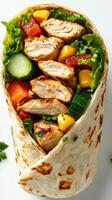 Delicious chicken wrap filled with fresh vegetables and herbs for a healthy meal option photo