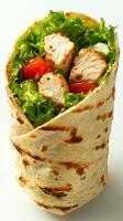 Fresh chicken wrap filled with crisp lettuce, tomatoes, and cucumbers ready for a healthy meal photo
