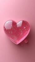 Heart-shaped gel with glitter on a pink background creating a whimsical and playful atmosphere photo