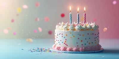 Colorful birthday cake with three candles and sprinkles on a festive background during a celebration photo