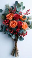 Colorful paper flower bouquet with eucalyptus and berries arranged on a light background photo