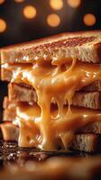 Delicious melted cheese oozing from stacked golden brown toasted sandwiches at a cozy setting photo