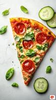 Delicious slice of pizza topped with pepperoni, fresh basil, and cucumber slices on a light background photo