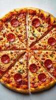 Pepperoni pizza sliced and ready to serve on a white table at a casual dining setting photo