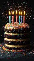 Birthday cake with colorful sprinkles and lit candles celebrates a special occasion at a festive party photo
