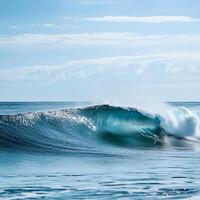 Blue ocean wave with white foam and blue sky in the background. Abstract background with waves. photo