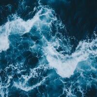 Aerial view of a stormy sea. Natural background and texture. Abstract background with blue waves. photo