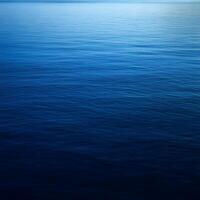 Blue water surface. Abstract nature background. Copy space for text. photo