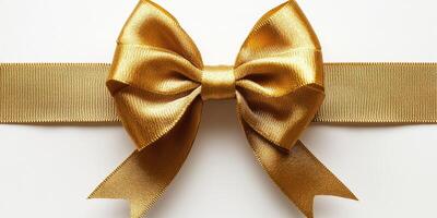 Elegant golden bow on a ribbon for festive occasions and gift wrapping photo