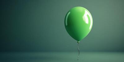 Green balloon floats in a minimalistic setting with a smooth surface and soft lighting photo