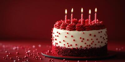 Delicious red velvet cake with candles ready for celebration on a festive table photo