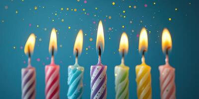 Colorful birthday candles with vibrant flames celebrating a joyful occasion surrounded by colorful confetti photo