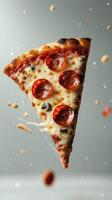 Perfectly melted cheese and pepperoni pizza slice floating in mid-air with an appealing background photo