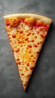 Delicious cheese pizza slice served on a dark textured surface with golden crust photo