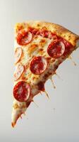 Delicious pepperoni pizza slice with gooey cheese captured in a bright setting photo