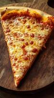 Tasty slice of cheese pizza on a wooden board ready to be enjoyed at a pizzeria during lunchtime photo