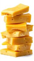 Cheddar cheese blocks stacked neatly, showcasing rich yellow color and texture, perfect for culinary uses and snacking photo