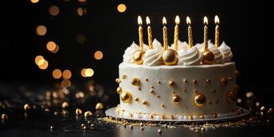 Beautiful birthday cake with golden decorations and lit candles celebrating a special occasion in a festive setting photo