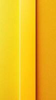 Bright yellow textured wall with contrasting smooth vertical stripe in a vibrant interior space during daylight photo