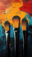 Brushes showcasing vibrant colors and textures on a canvas during an artistic creation process in a studio setting photo
