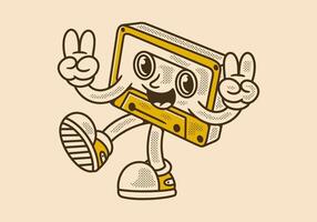 Tape cassette mascot character in happy expression, hands forming peace symbol. in retro look vector