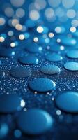 Raindrops create a mesmerizing pattern on a blue surface during a calm morning photo