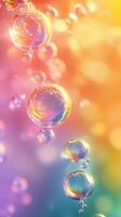 Colorful bubbles float against a vibrant background of soft pastel shades creating a playful atmosphere photo
