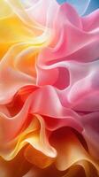 Colorful abstract fabric waves flowing together with soft gradients in shades of pink, orange, and yellow photo