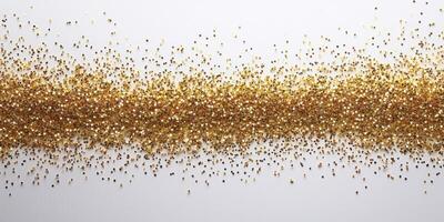 Golden glitter scattered across a white surface creates a shimmering and elegant backdrop ideal for celebrations and artistic displays photo