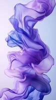 Soft flowing fabric in shades of purple creating an artistic display against a light background photo