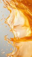 Vibrant orange liquid splashes against a neutral background, capturing the energy of motion photo