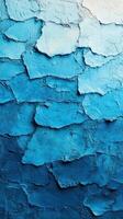 Beautiful layered texture of blue paint on surface captures a striking gradient from light to dark tones photo