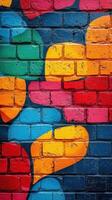Brightly colored mural on brick wall showcasing vibrant abstract shapes in urban setting photo