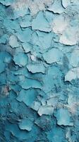Blue textured wall displays layers of peeling paint and unique patterns under soft lighting at an art installation photo