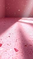 Bright pink terrazzo floor with scattered pieces and sunlight streaming in through a window photo