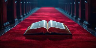 Open book resting on a red carpet in a quiet church sanctuary with wooden pews and soft lighting photo