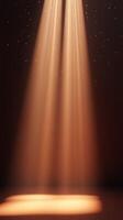 Soft golden light illuminates a stage with sparkling particles creating a magical atmosphere during an evening performance photo