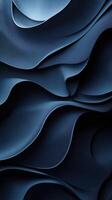 Layers of deep blue fabric create an abstract textured composition evoking depth and elegance photo