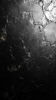 Abstract black and white textured surface created by unique patterns and reflections in light and shadow during daylight photo
