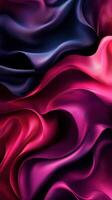 Abstract silk fabric in rich hues of deep blue, red, and pink creating flowing textures and patterns photo
