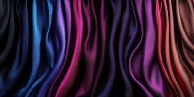 Vibrant colors and textures of silk fabric draped elegantly in shades of blue, purple, and red photo