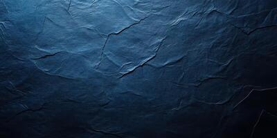 Dark textured surface with subtle creases and shadows creating an artistic backdrop for various applications photo