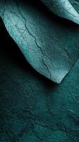 Unique teal textured paper showcasing intricate details and natural patterns under soft lighting photo