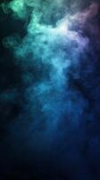 Colorful smoke swirling in the air creates an ethereal atmosphere during nighttime in a dimly lit environment photo