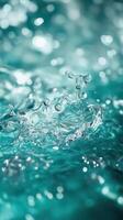 Splash of water drops creating ripples with sparkling reflections in a tranquil pool at midday photo