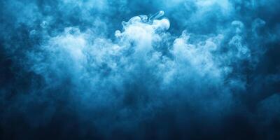 Soft blue smoke swirls gracefully, creating an ethereal atmosphere in a dimly lit environment photo