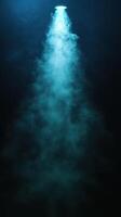 Mysterious light beam penetrating dark underwater environment creating an ethereal atmosphere photo