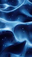 Vibrant blue abstract waves with glowing particles showcasing fluid motion and depth photo