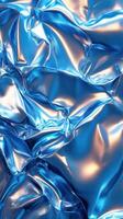Textured blue fabric with shiny surface reflecting light in an abstract pattern photo