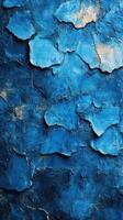 Vibrant blue textured surface showcasing unique layers and patterns found in urban art environments photo